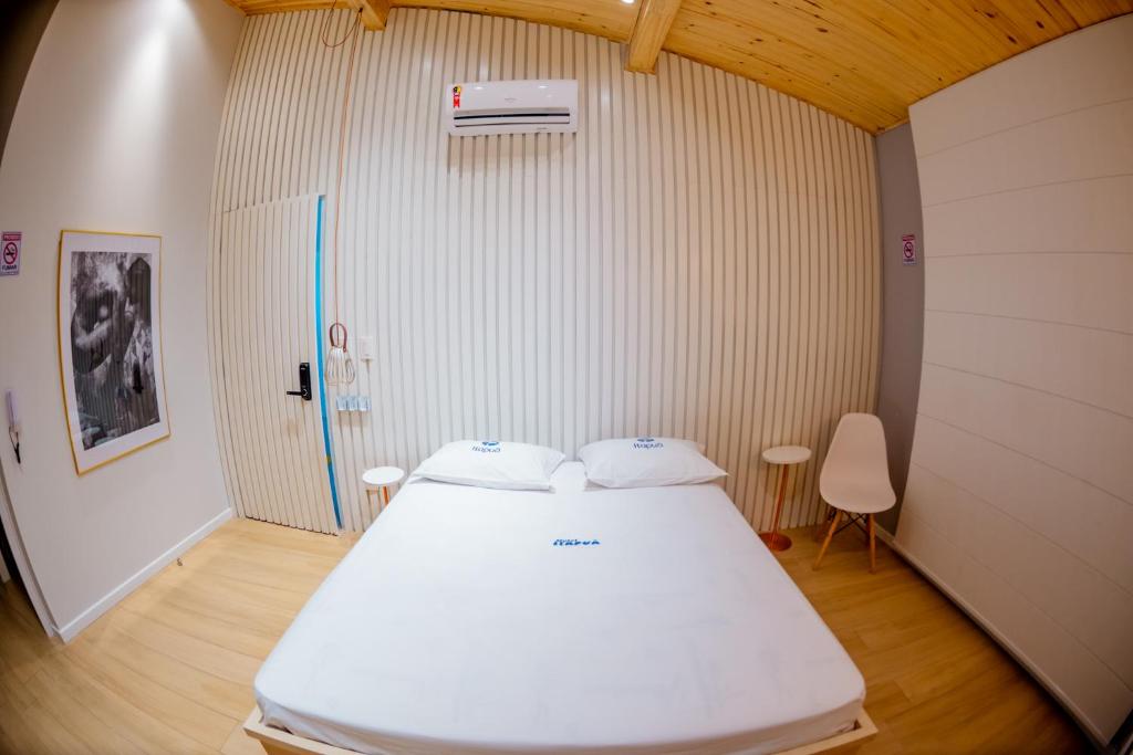 Postel nebo postele na pokoji v ubytování Motel Itapuã I Fx Nova Camobi