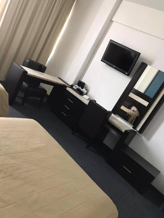 TV a/nebo společenská místnost v ubytování Hotel Real Rex