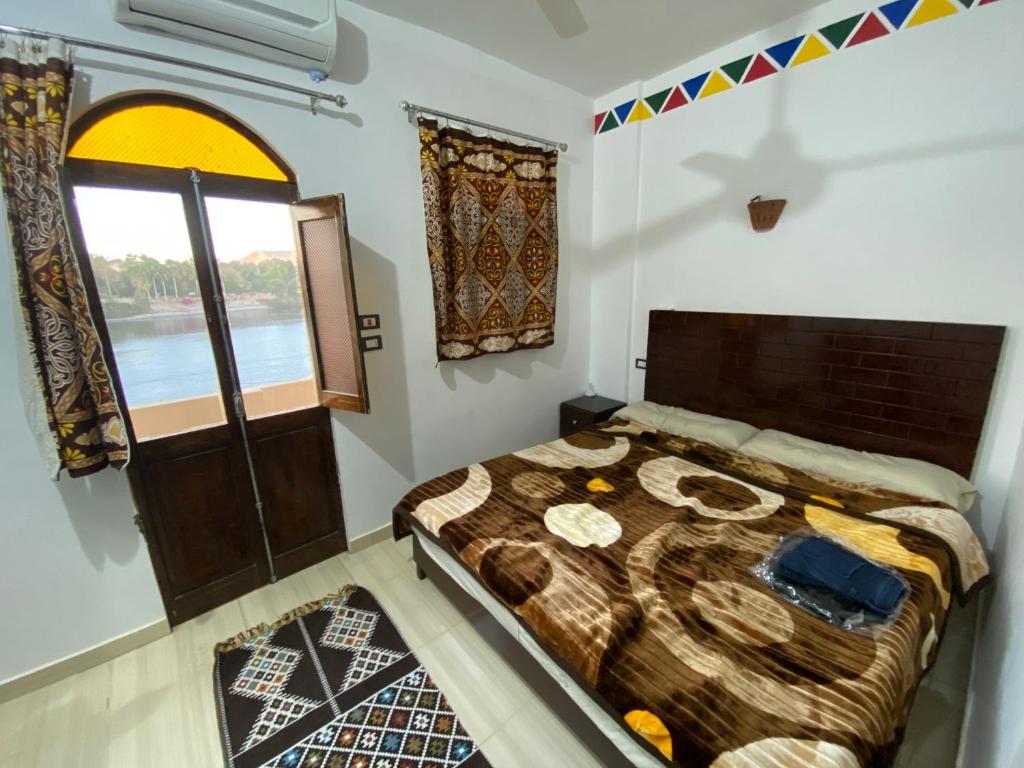 Postel nebo postele na pokoji v ubytování ABAZIDO Nubian Guest House