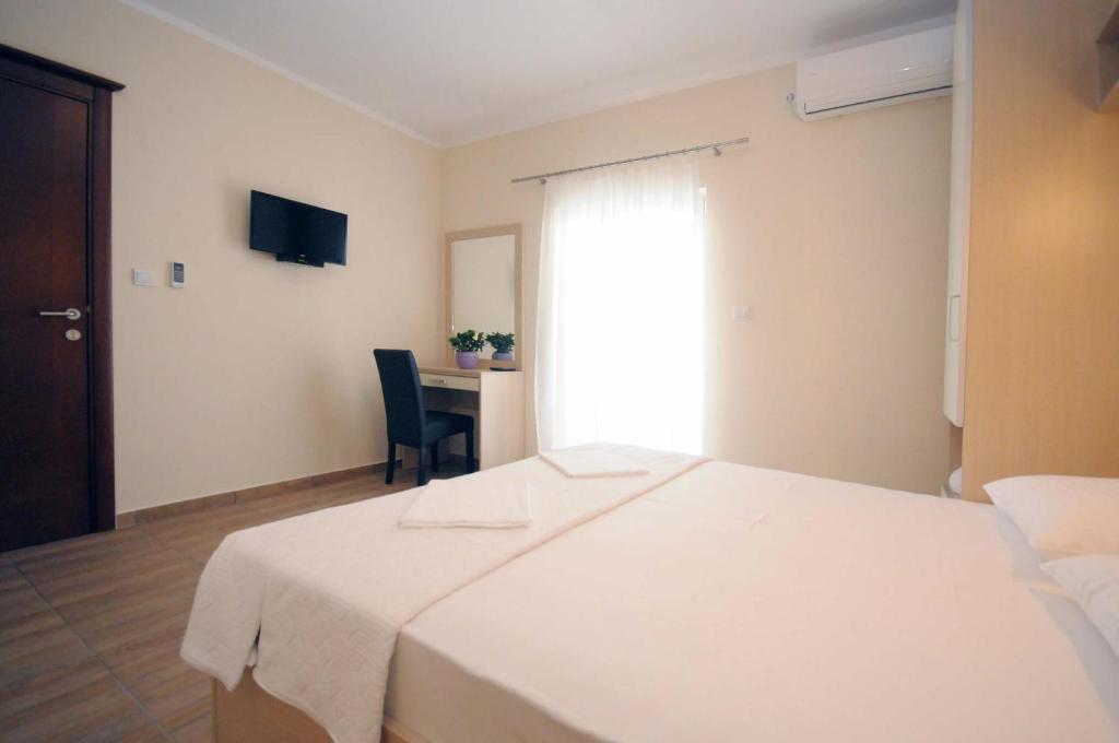 Postel nebo postele na pokoji v ubytování Apartments Royal
