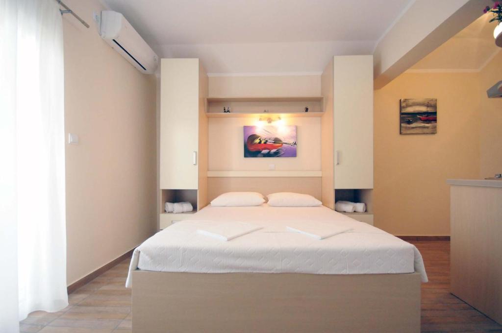Postel nebo postele na pokoji v ubytování Apartments Royal