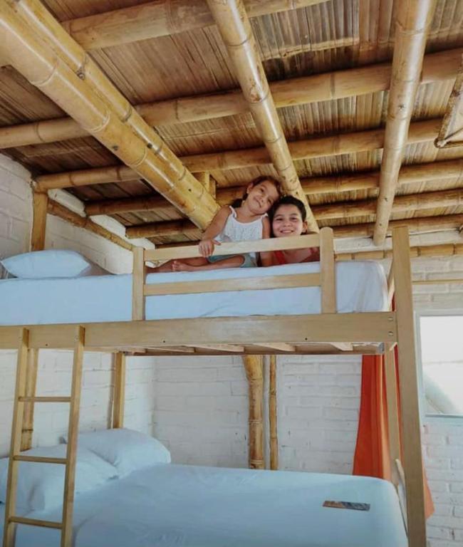 Postel nebo postele na pokoji v ubytování Cabalonga EcoAdventure