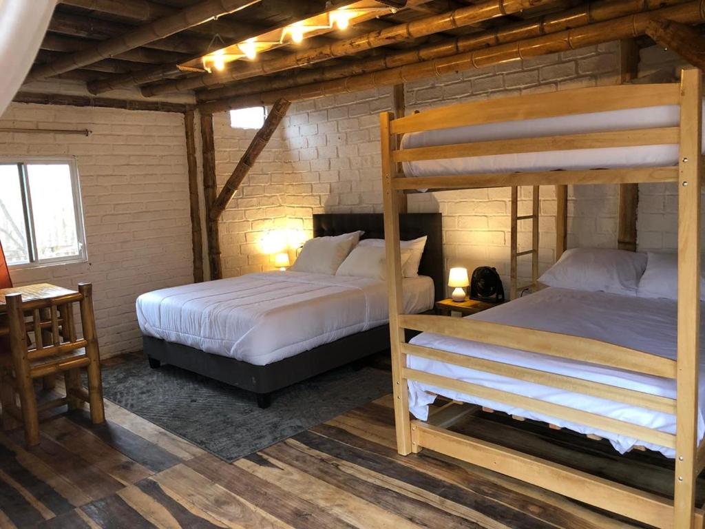 Postel nebo postele na pokoji v ubytování Cabalonga EcoAdventure