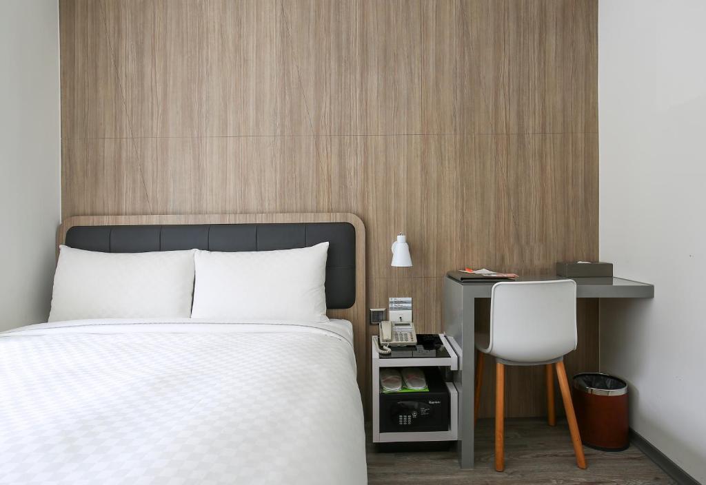 Postel nebo postele na pokoji v ubytování CityInn Hotel Plus - Taichung Station Branch