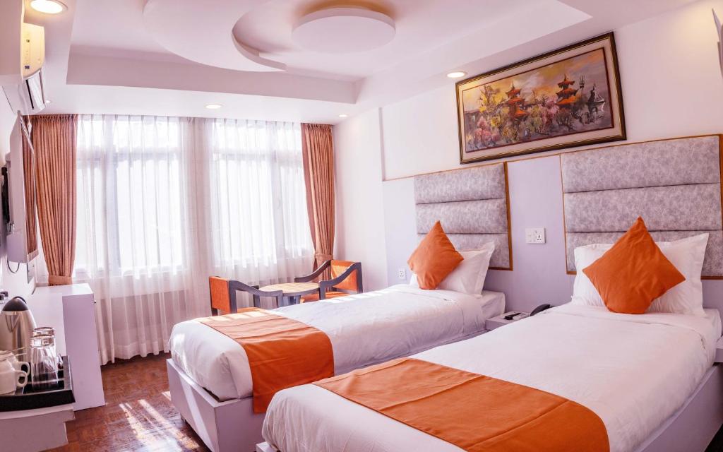 Postel nebo postele na pokoji v ubytování Durbar Hotel & Residence