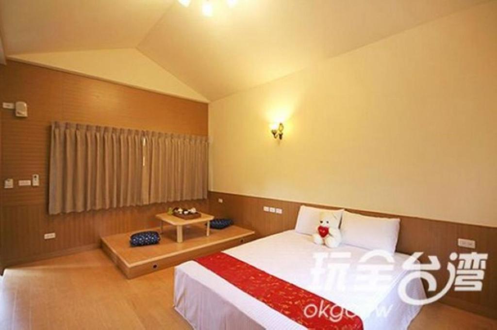Voodi või voodid majutusasutuse Yun Cui Leisure B&B toas
