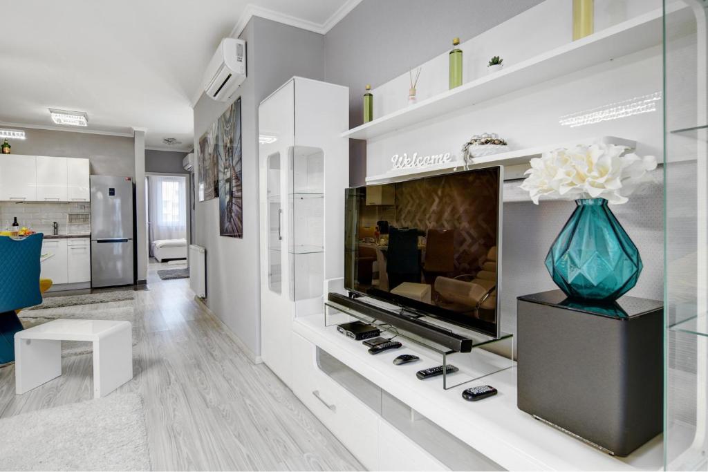 Televiisor ja/või meelelahutuskeskus majutusasutuses Vision Apartments Budapest