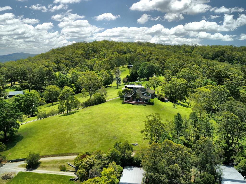 an aerial view of a house on a large green field at Cabins @ The View in Ocean View