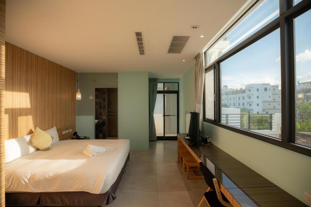 Postel nebo postele na pokoji v ubytování HUA B&B