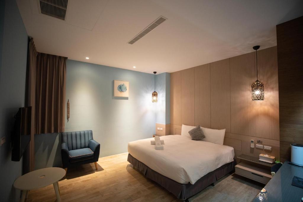 Postel nebo postele na pokoji v ubytování HUA B&B