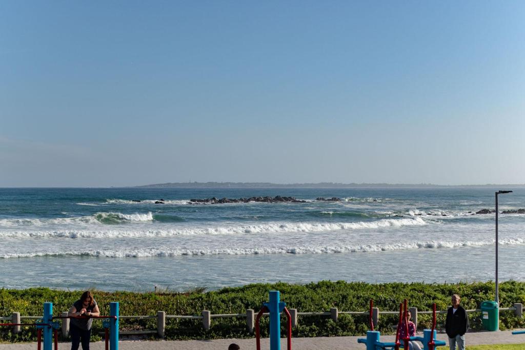 a group of children playing at the beach at Blaauw Village Guest House in Bloubergstrand