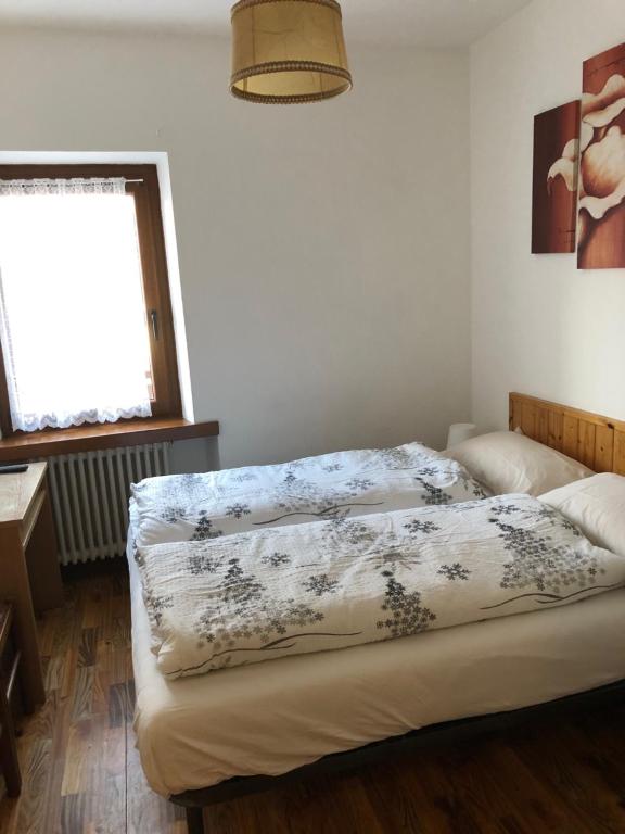 Postel nebo postele na pokoji v ubytování B&B Astor