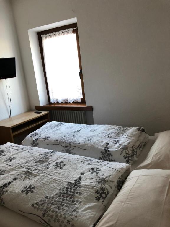 Postel nebo postele na pokoji v ubytování B&B Astor