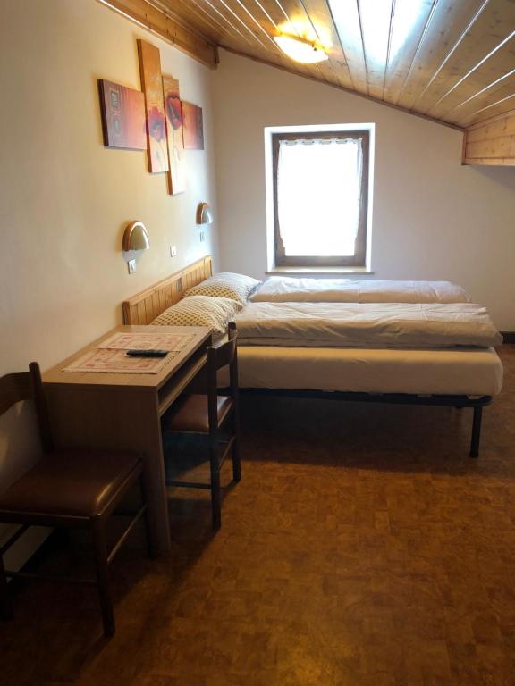 Postel nebo postele na pokoji v ubytování B&B Astor