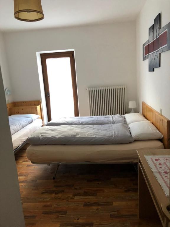 Postel nebo postele na pokoji v ubytování B&B Astor