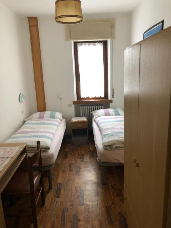 Postel nebo postele na pokoji v ubytování B&B Astor