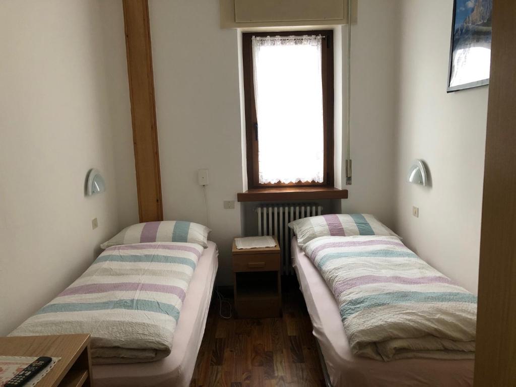 Postel nebo postele na pokoji v ubytování B&B Astor