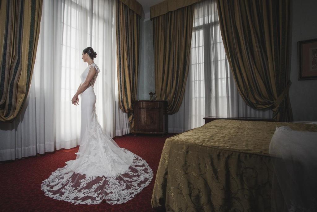 Postel nebo postele na pokoji v ubytování Grand Hotel Cesenatico