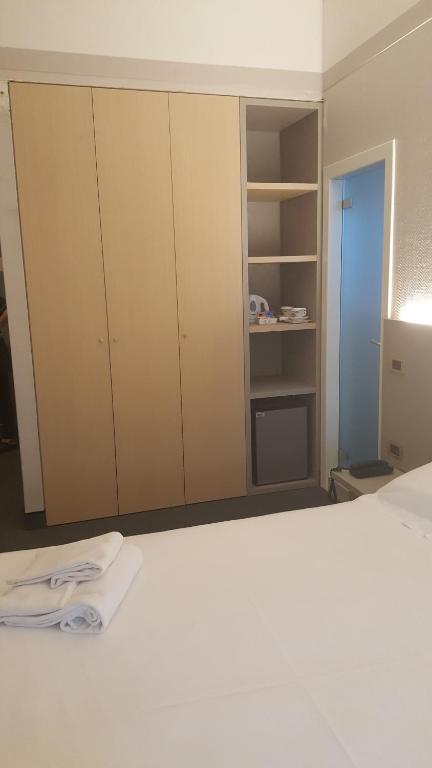 Postel nebo postele na pokoji v ubytování Hotel Augustus