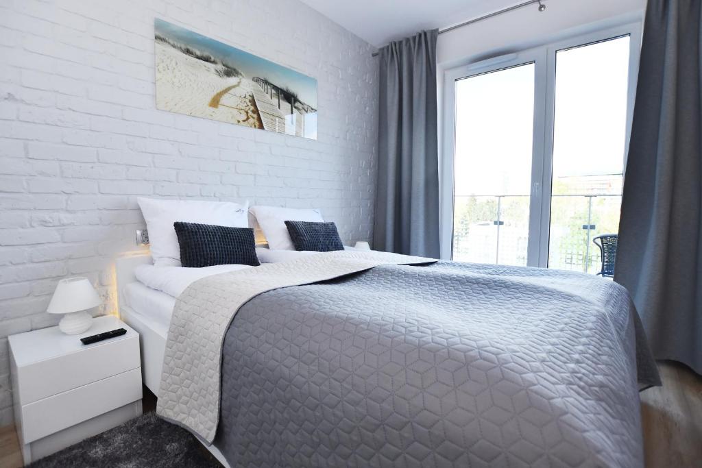 Postel nebo postele na pokoji v ubytování Kołobrzeskie Wybrzeże - Solna 403