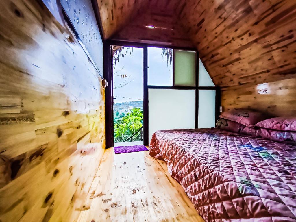 Postel nebo postele na pokoji v ubytování Flourish Homestay