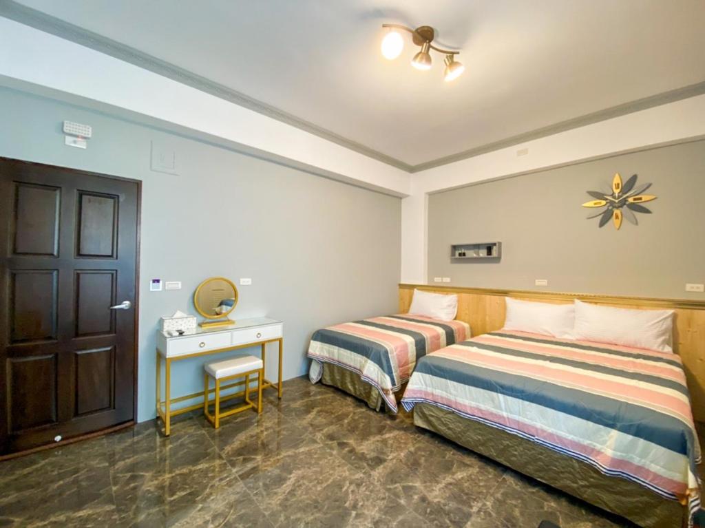 Postel nebo postele na pokoji v ubytování 15電梯民宿