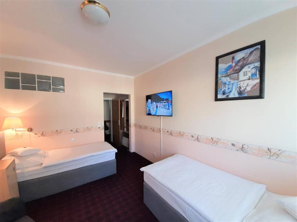 Postel nebo postele na pokoji v ubytování Hotel Krupp