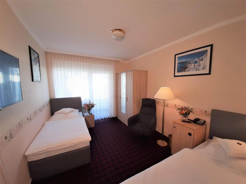 Postel nebo postele na pokoji v ubytování Hotel Krupp