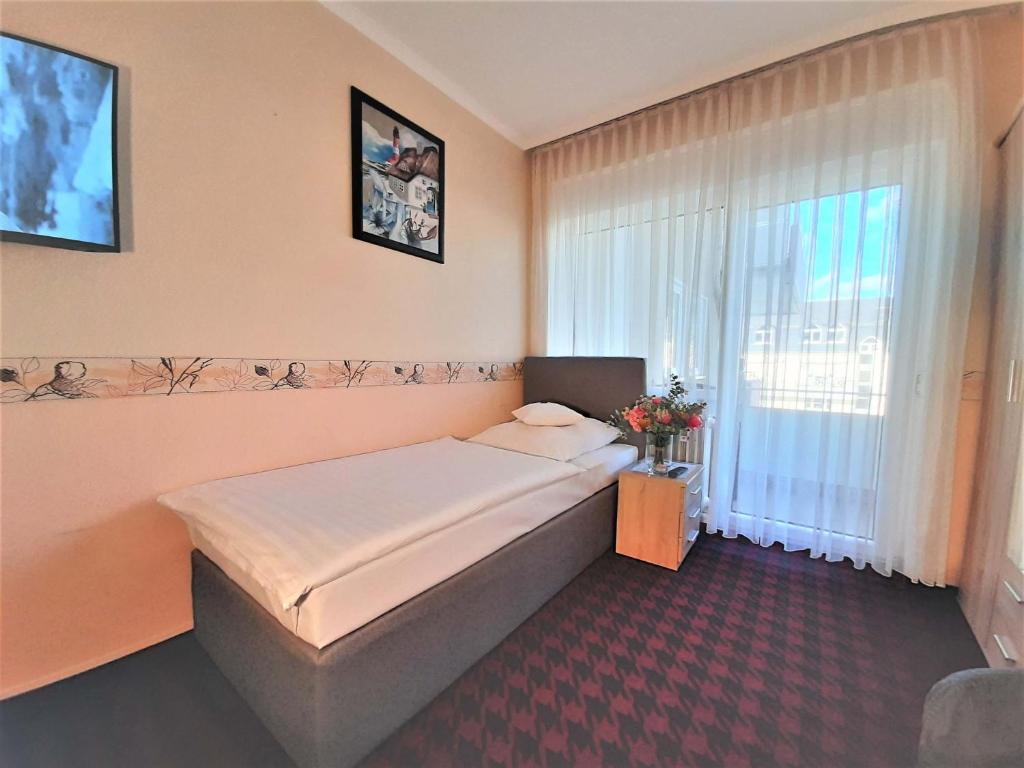 Postel nebo postele na pokoji v ubytování Hotel Krupp