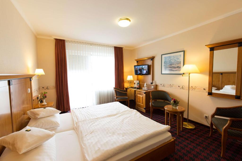 Postel nebo postele na pokoji v ubytování Hotel Krupp
