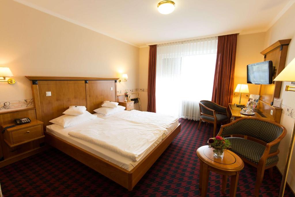 Postel nebo postele na pokoji v ubytování Hotel Krupp