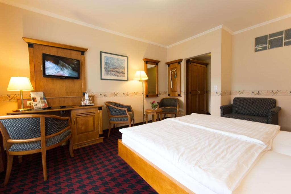 Postel nebo postele na pokoji v ubytování Hotel Krupp