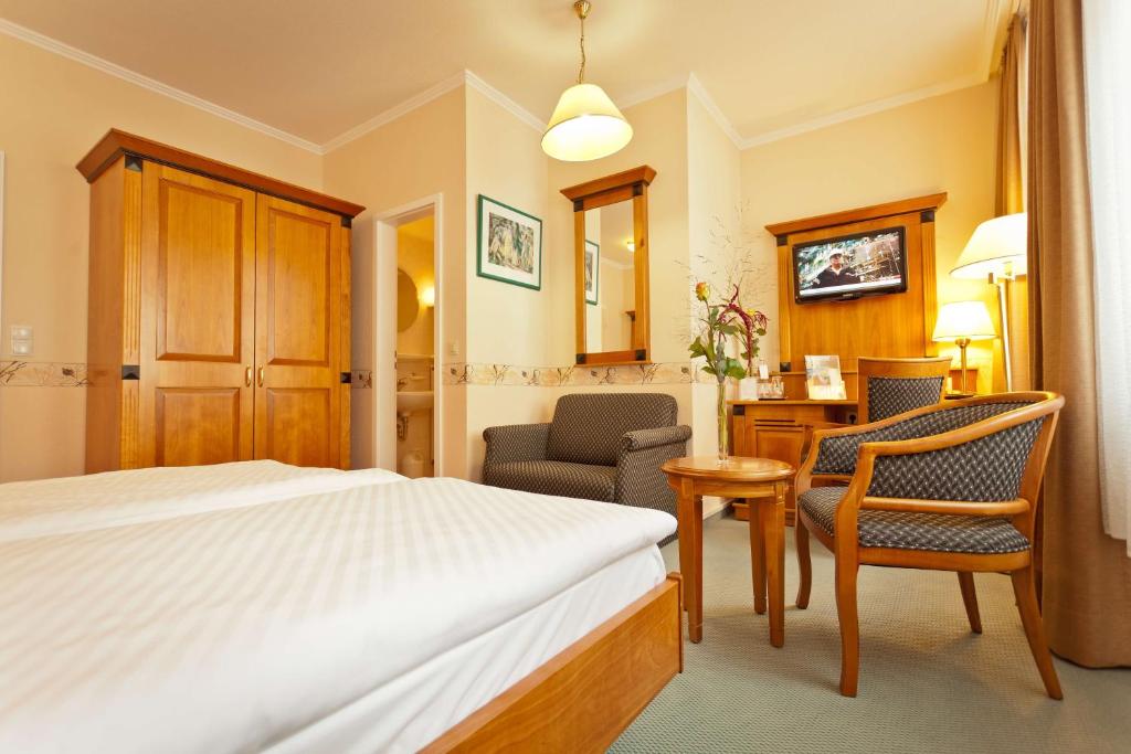 Postel nebo postele na pokoji v ubytování Hotel Krupp