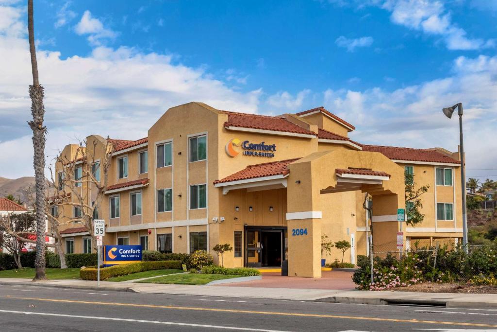a large building with a clock on the front of it at Comfort Inn & Suites Ventura Beach in Ventura