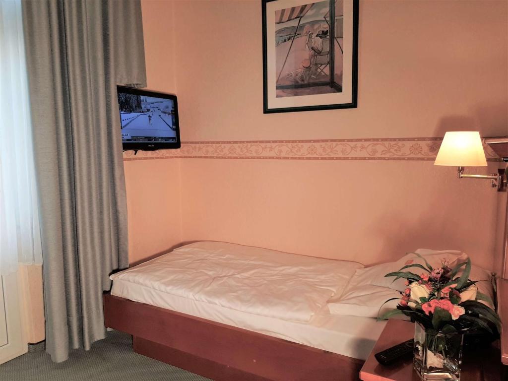 Postel nebo postele na pokoji v ubytování Hotel Krupp