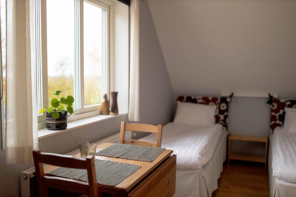 Postel nebo postele na pokoji v ubytování Ljungs Fem Rum