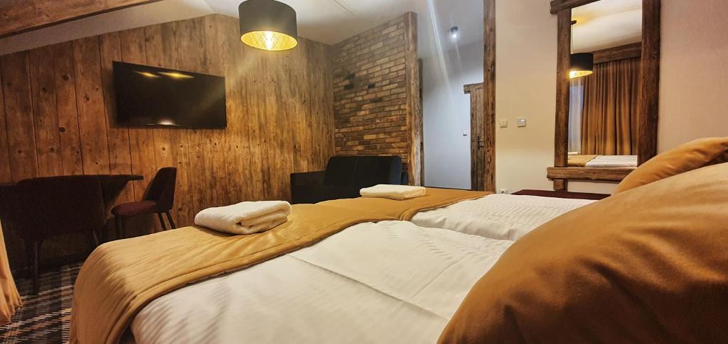 Postel nebo postele na pokoji v ubytování Ranč Regetovka
