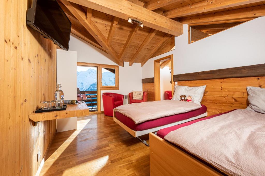 Postel nebo postele na pokoji v ubytování Hotel Slalom