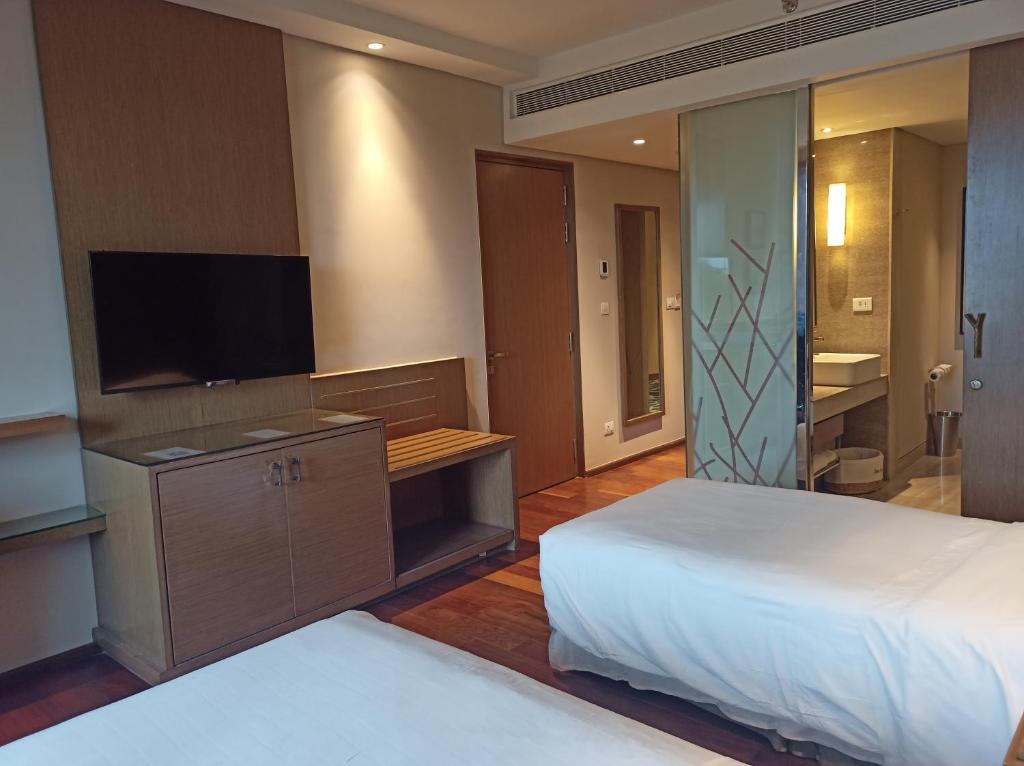 Postel nebo postele na pokoji v ubytování Welcomhotel by ITC Hotels, Richmond Road, Bengaluru