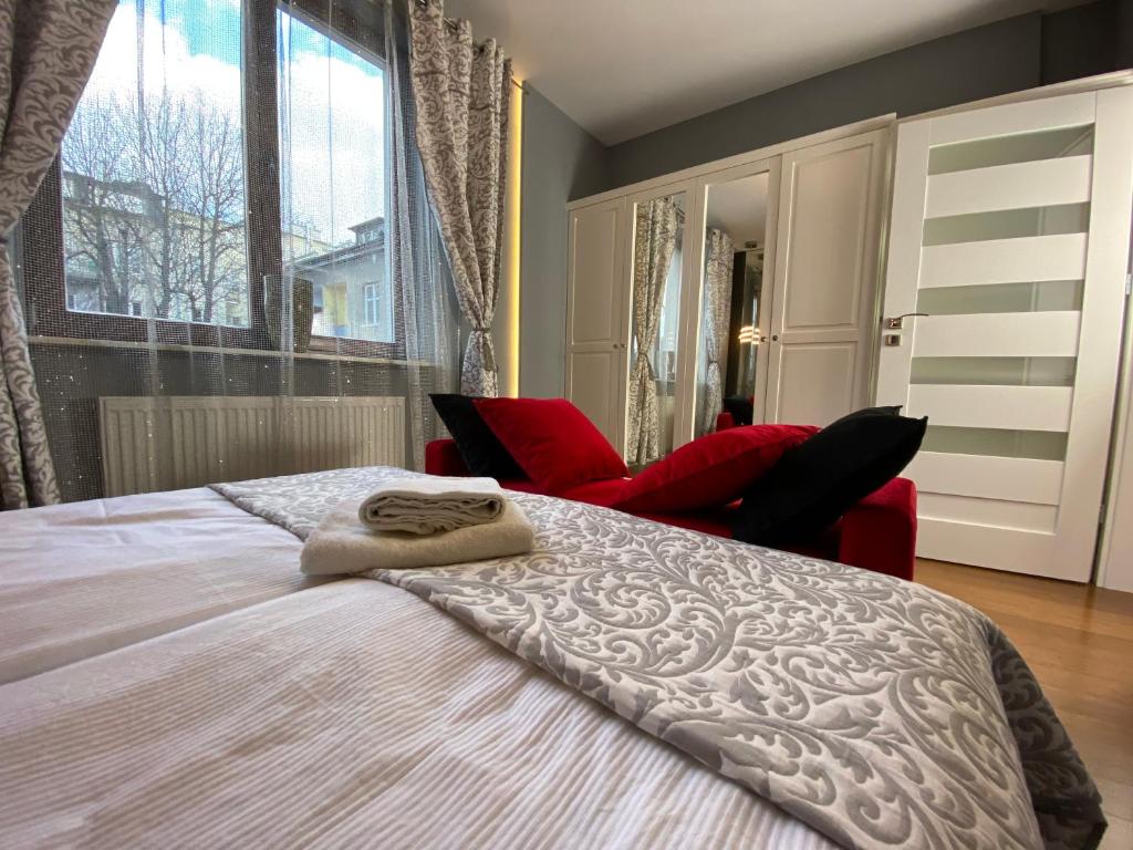 Postel nebo postele na pokoji v ubytování P&J Apartments Lubicz