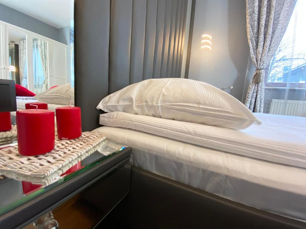 Postel nebo postele na pokoji v ubytování P&J Apartments Lubicz