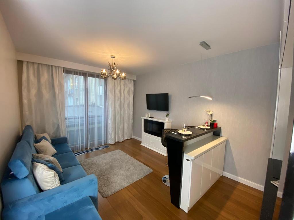 TV a/nebo společenská místnost v ubytování P&J Apartments Lubicz