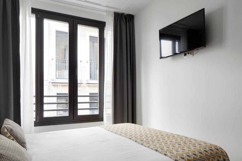 TV a/nebo společenská místnost v ubytování Hostal Arriazu