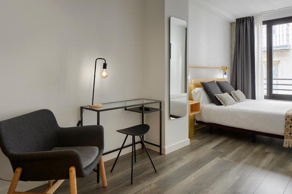 Postel nebo postele na pokoji v ubytování Hostal Arriazu