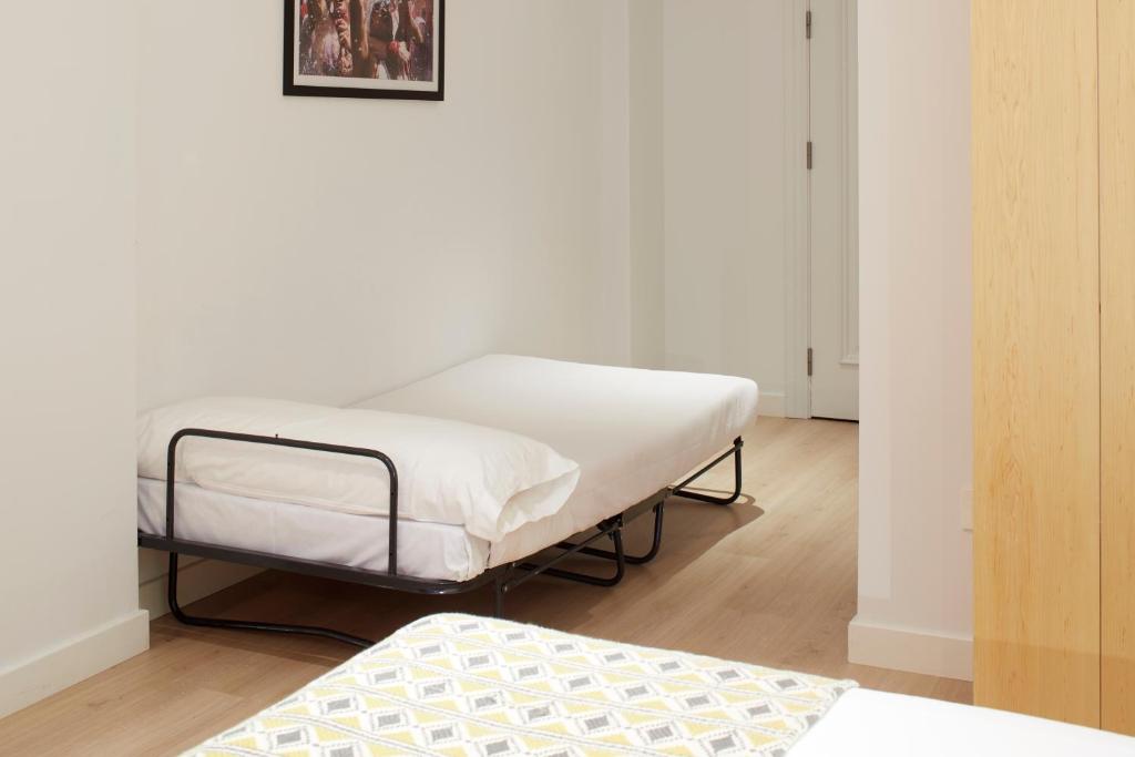 Postel nebo postele na pokoji v ubytování Hostal Arriazu