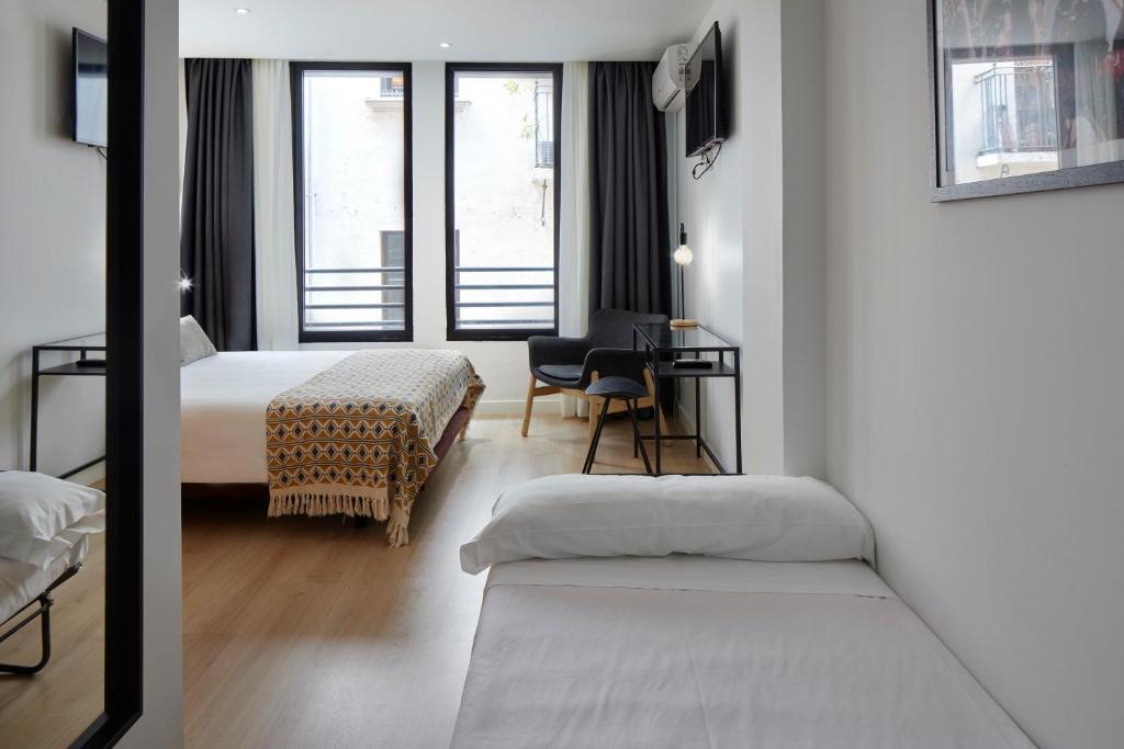 Postel nebo postele na pokoji v ubytování Hostal Arriazu