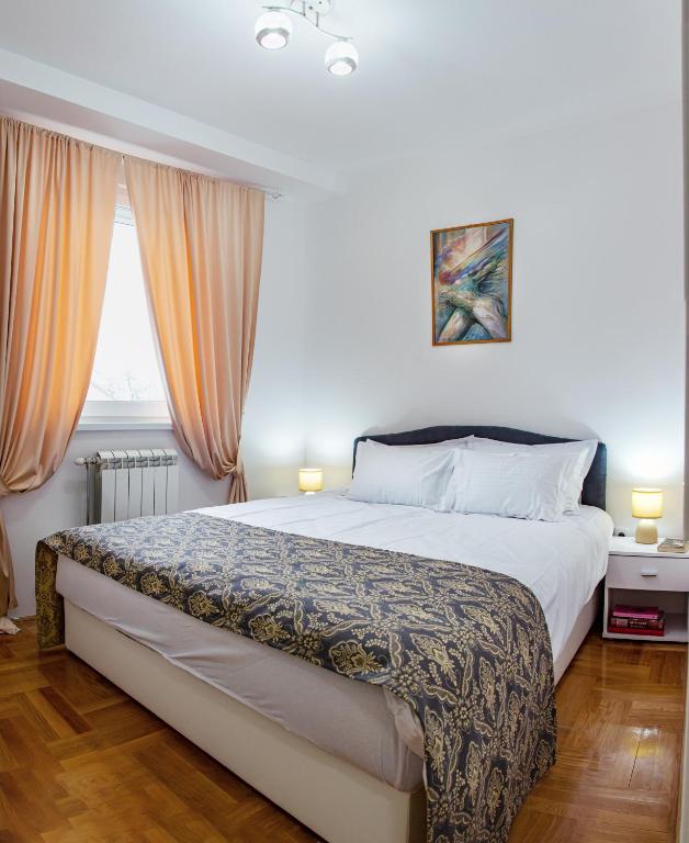 Postel nebo postele na pokoji v ubytování Apartman Mia