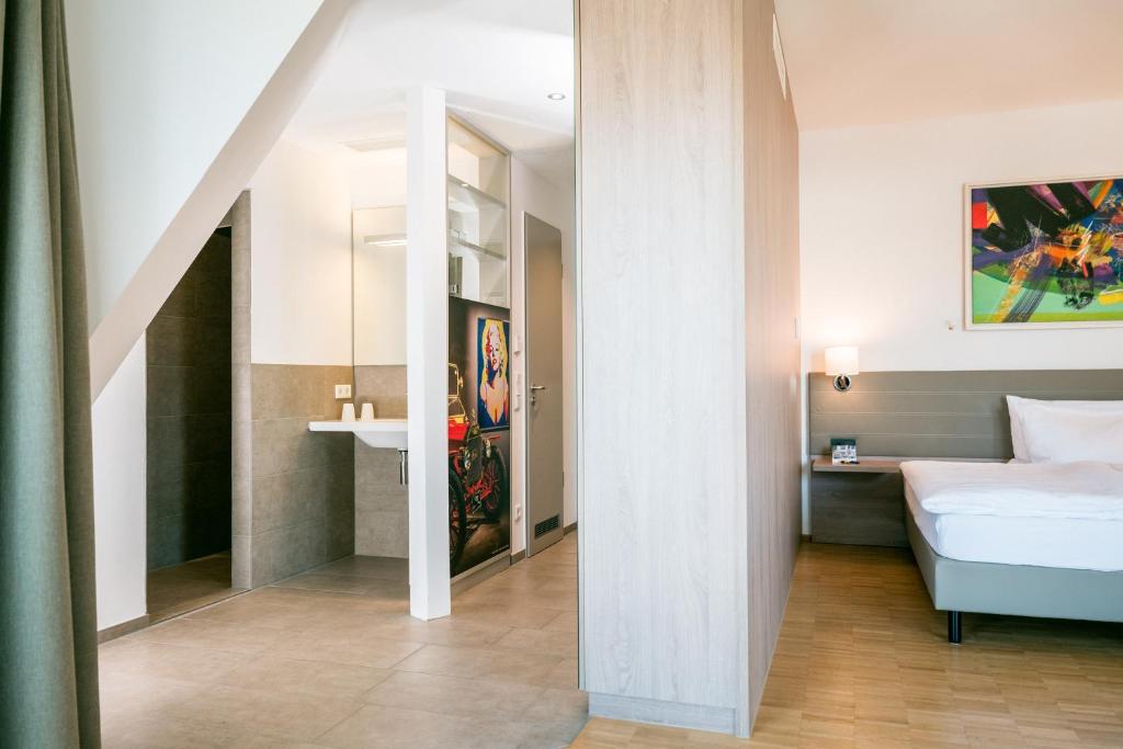 Postel nebo postele na pokoji v ubytování Hotel Trezor