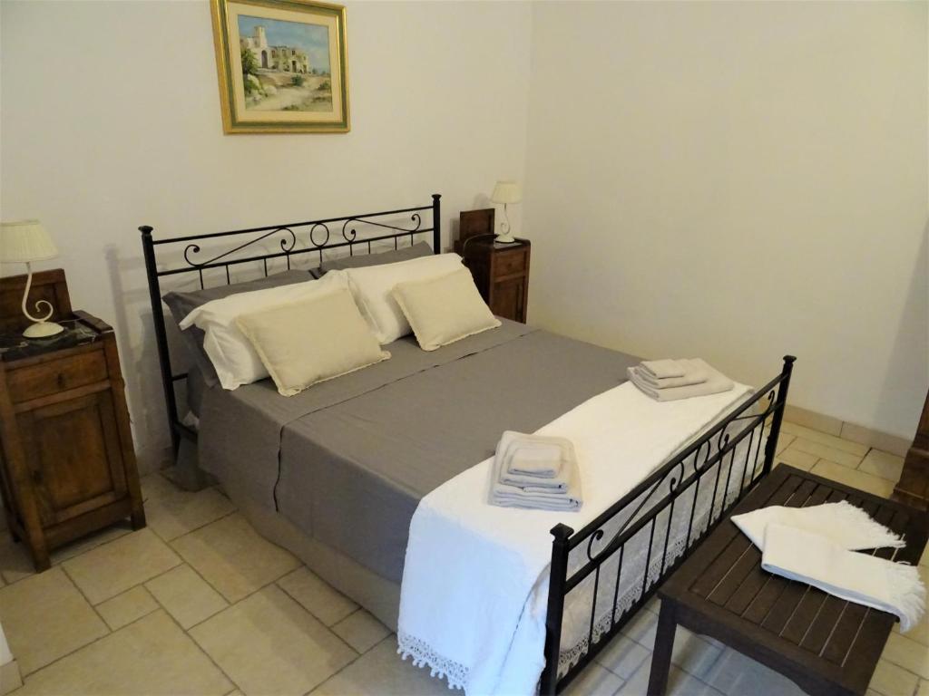 Postel nebo postele na pokoji v ubytování Masseria Scianne