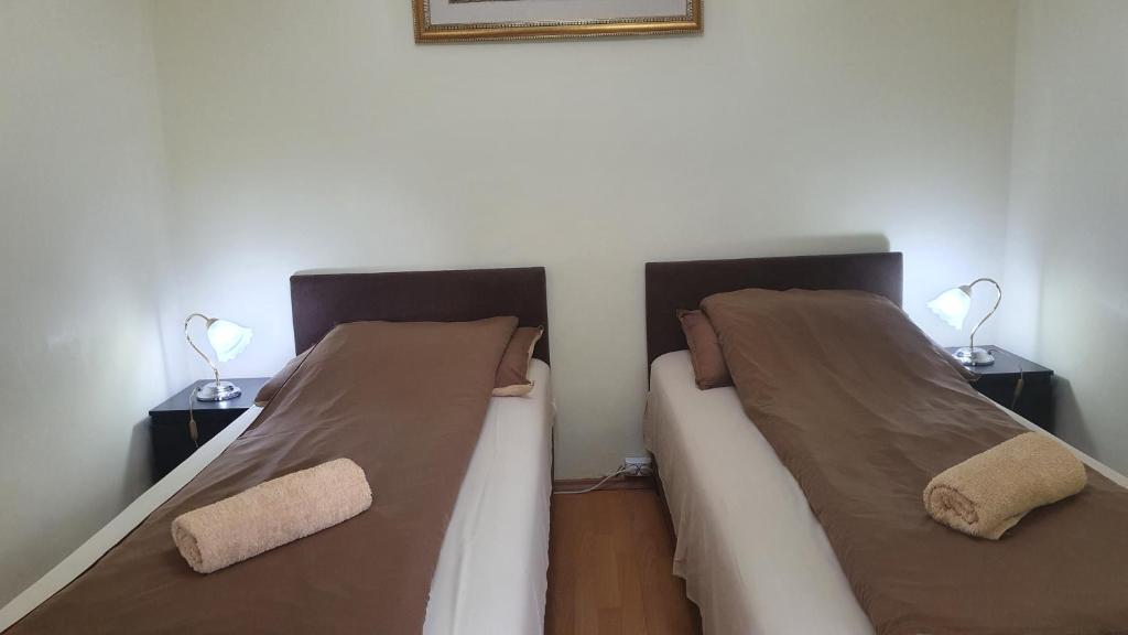 Postel nebo postele na pokoji v ubytování Ruttkai Vendégház